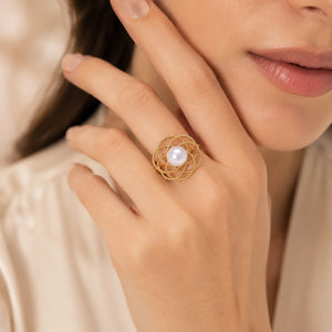 Close-up of pearl-style beads and loop ring detailing