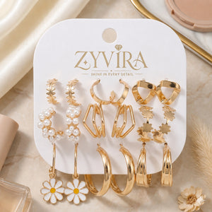 Gold pearl floral earring combo styled in an elegant jewellery flat lay
