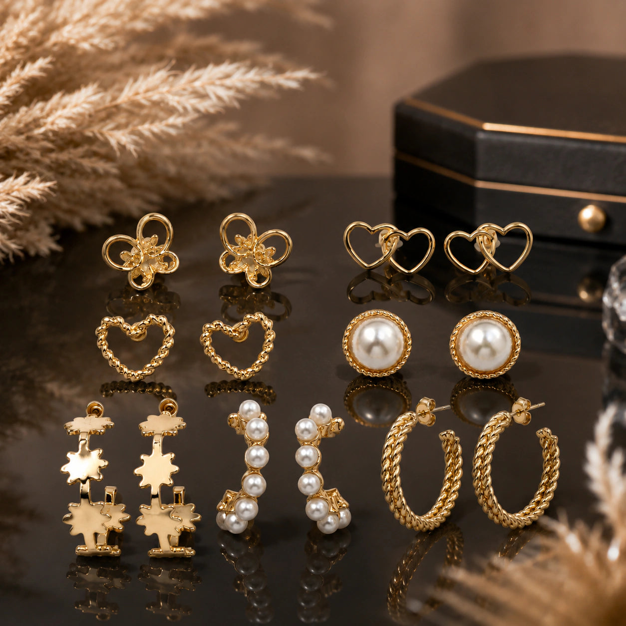 Close-up of pearl, heart and butterfly earring details