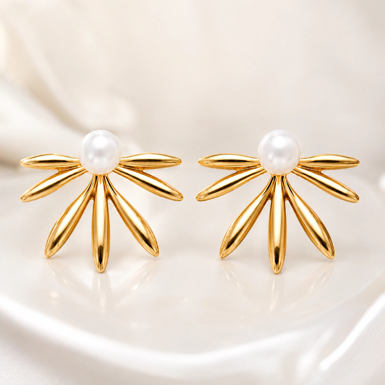 Close-up of sunburst fan textures and pearl-style centres