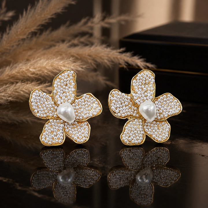 Gold pearl-style teardrop sculpted floral stud earrings