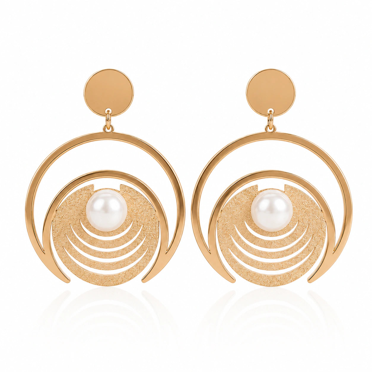 Angled view of gold pearl-style textured hoop earrings