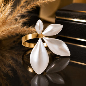 Close-up of pearl-white four-petal botanical detailing
