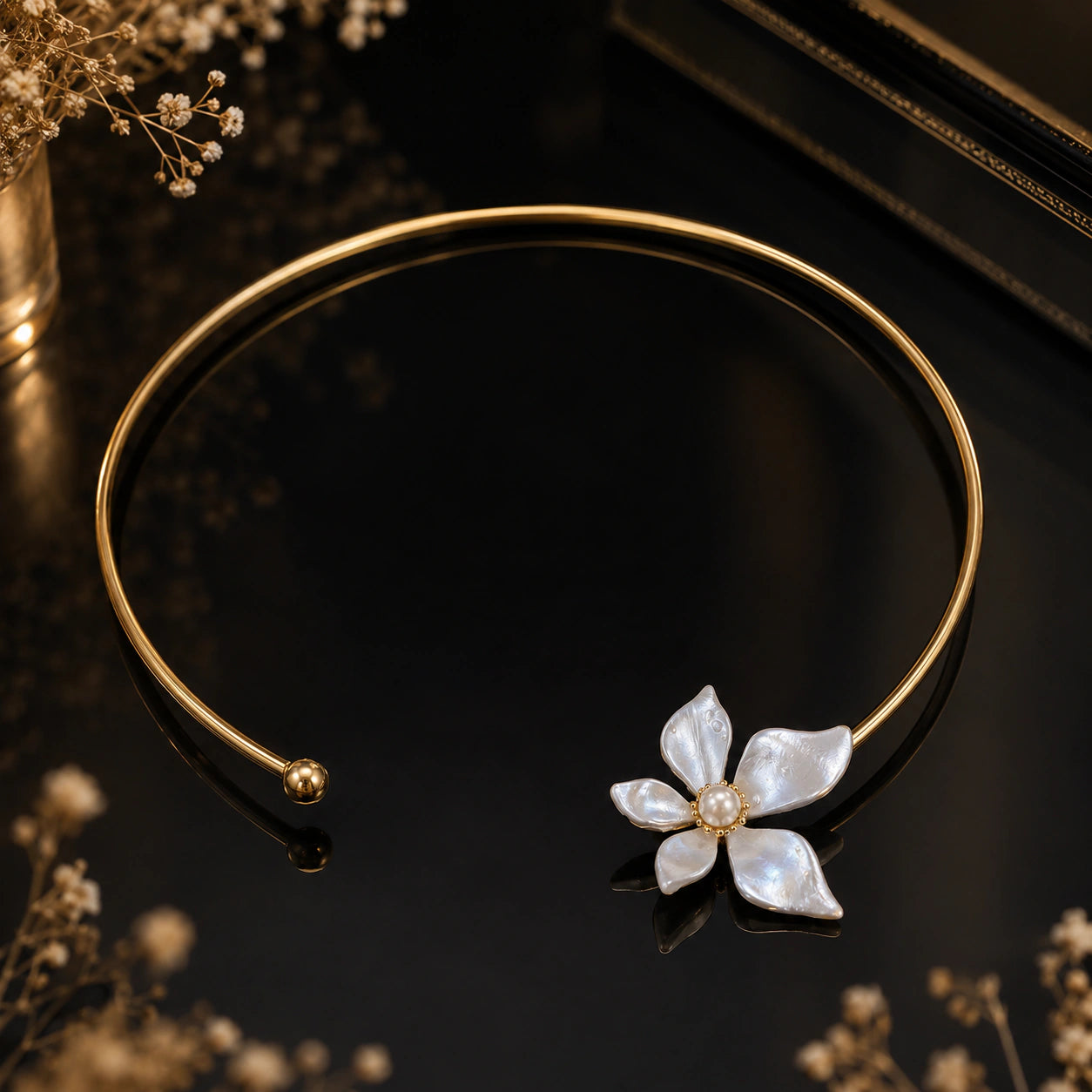 Angled view of the gold pearl-white floral Hasali
