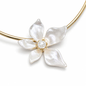 Gold pearl-white floral Hasali on a dark jewellery studio display