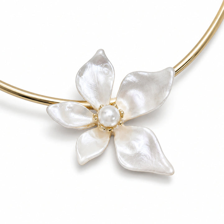 Gold pearl-white floral Hasali on a dark jewellery studio display