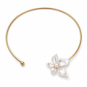 Gold pearl-white floral Hasali styled in an elegant jewellery flat lay