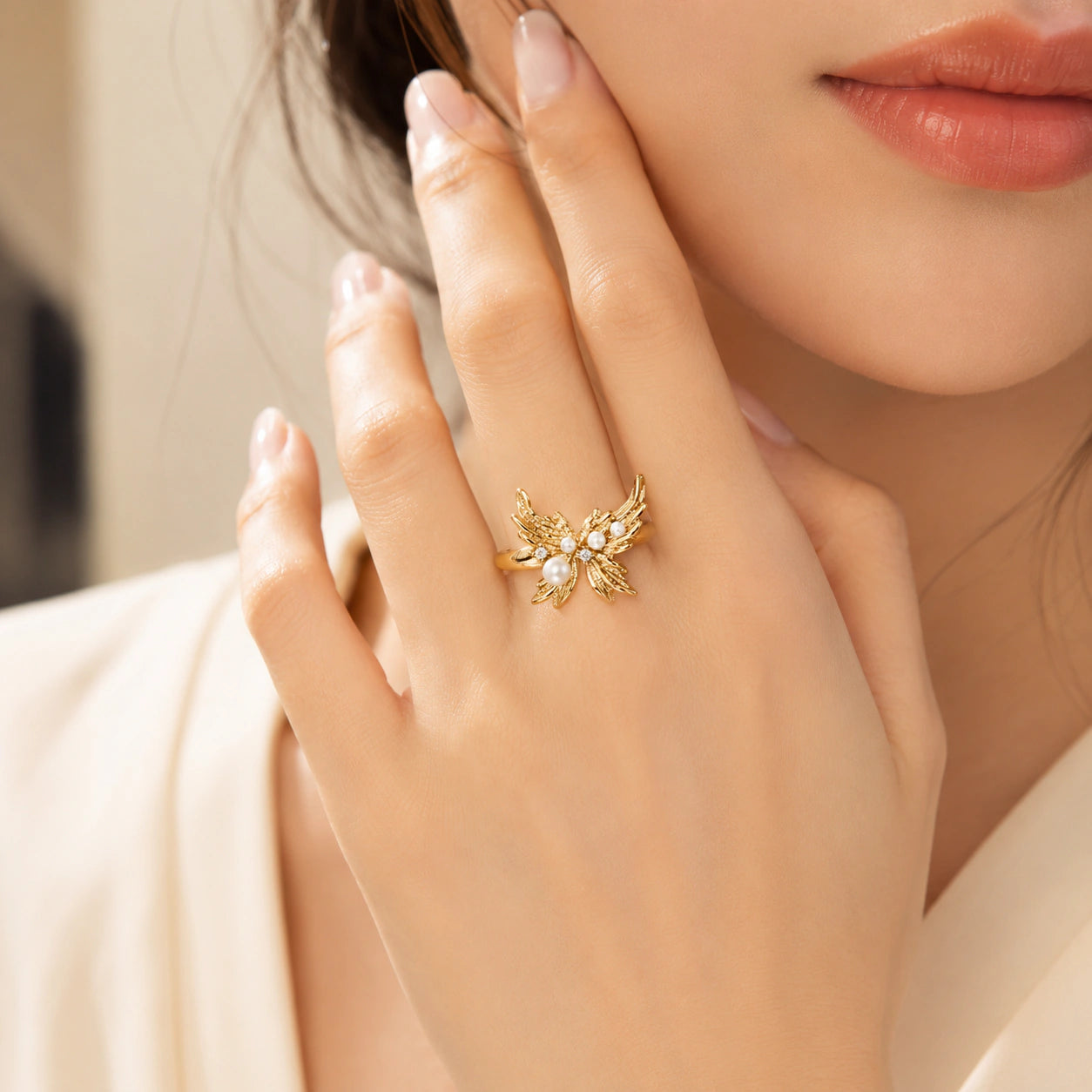 Close-up of pearl-style accents and sculpted wing detailing