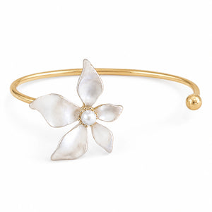 Close-up of pearly five-petal flowers and gold detailing