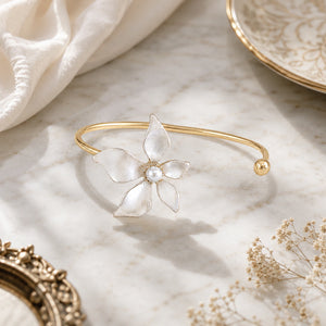 Side view of the gold pearly five-petal floral kada