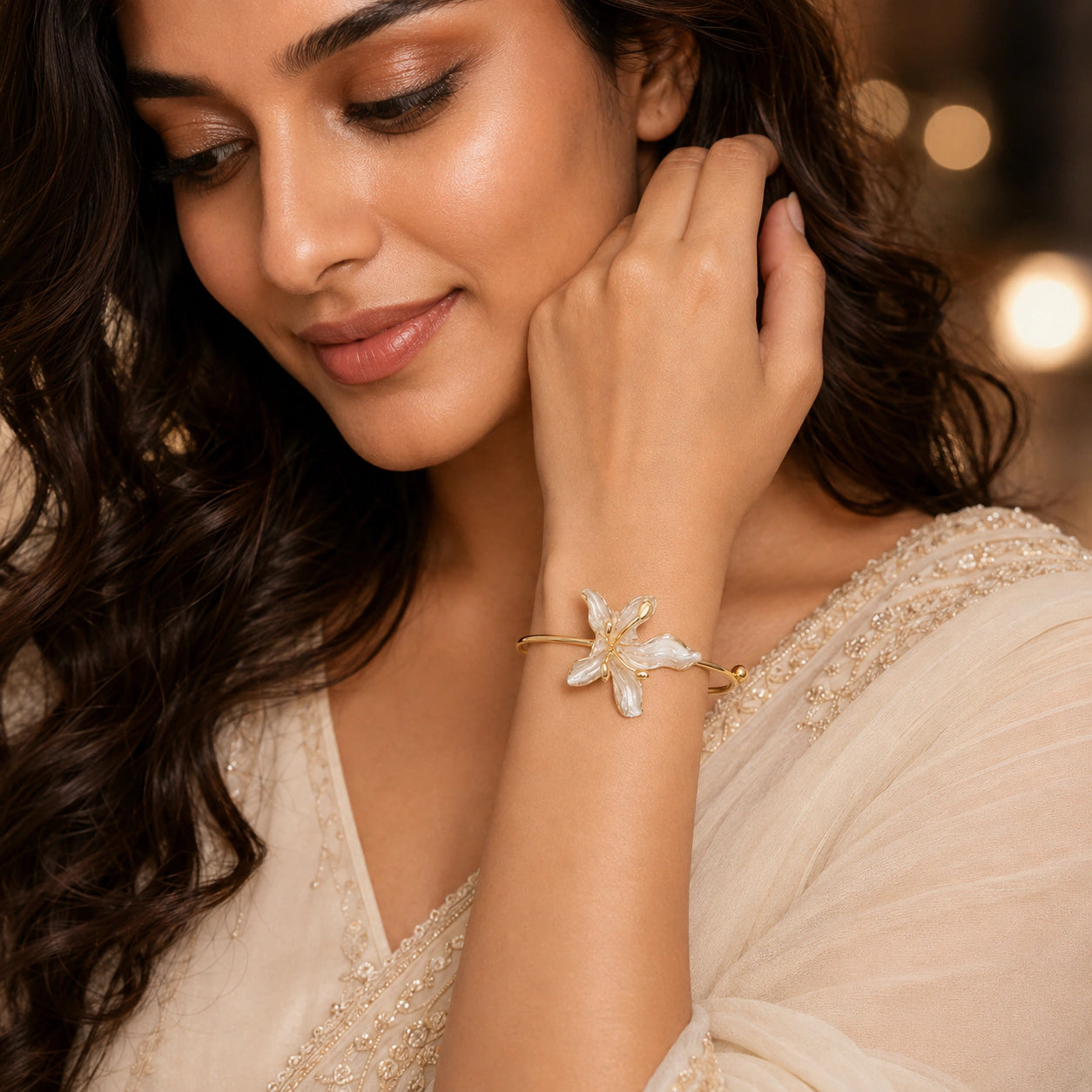 Angled view of the gold pearly lily open kada