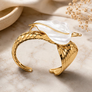 Side view of the gold pearly sculptural leaf kada