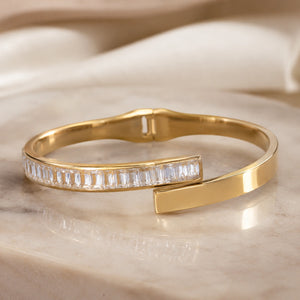 Side view of the gold rectangular crystal open cuff