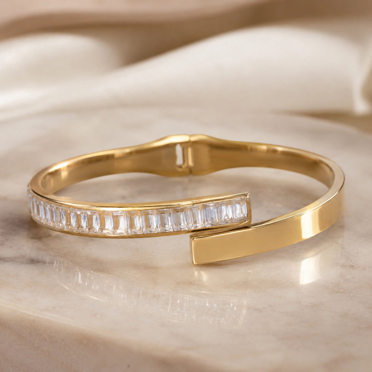 Side view of the gold rectangular crystal open cuff