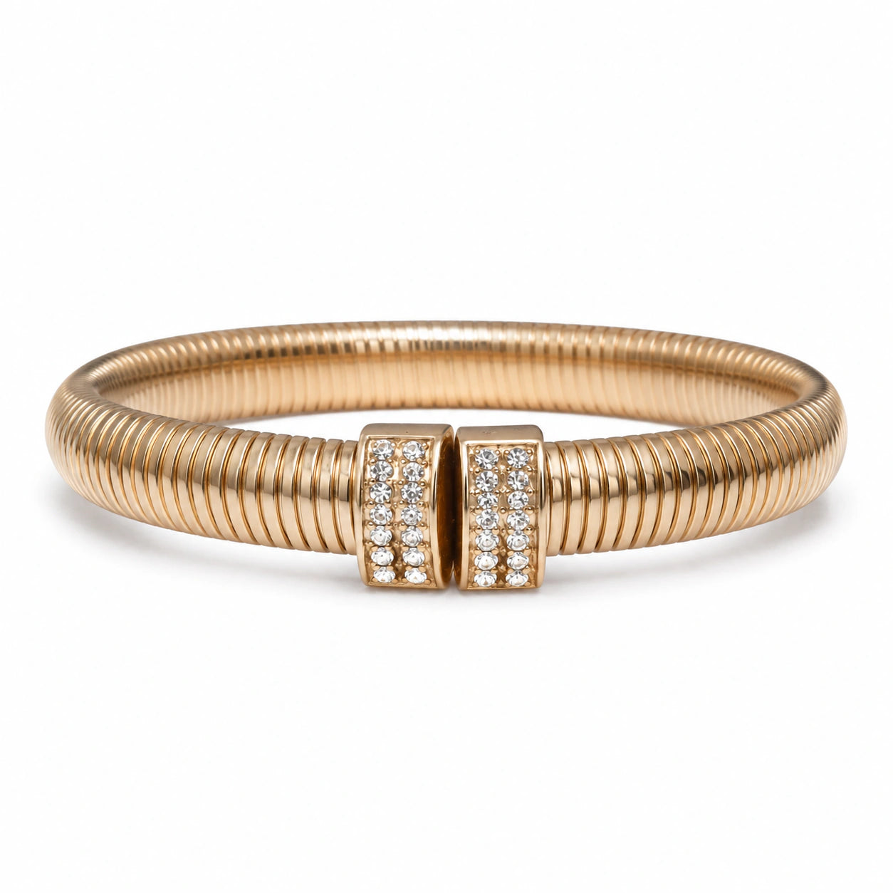 Angled view of the gold ribbed coil crystal cuff