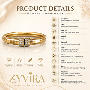 Gold ribbed coil cuff styled in an elegant jewellery flat lay