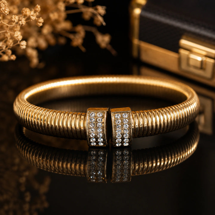 Gold-tone ribbed coil crystal end-cap cuff bracelet