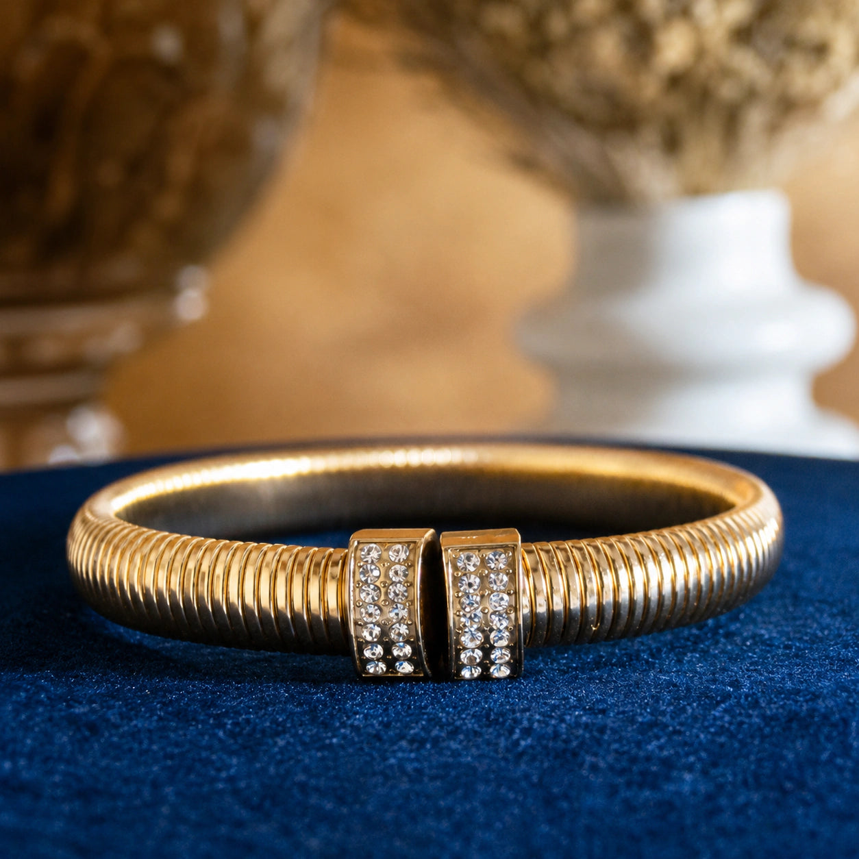 Side view of the gold ribbed coil crystal cuff