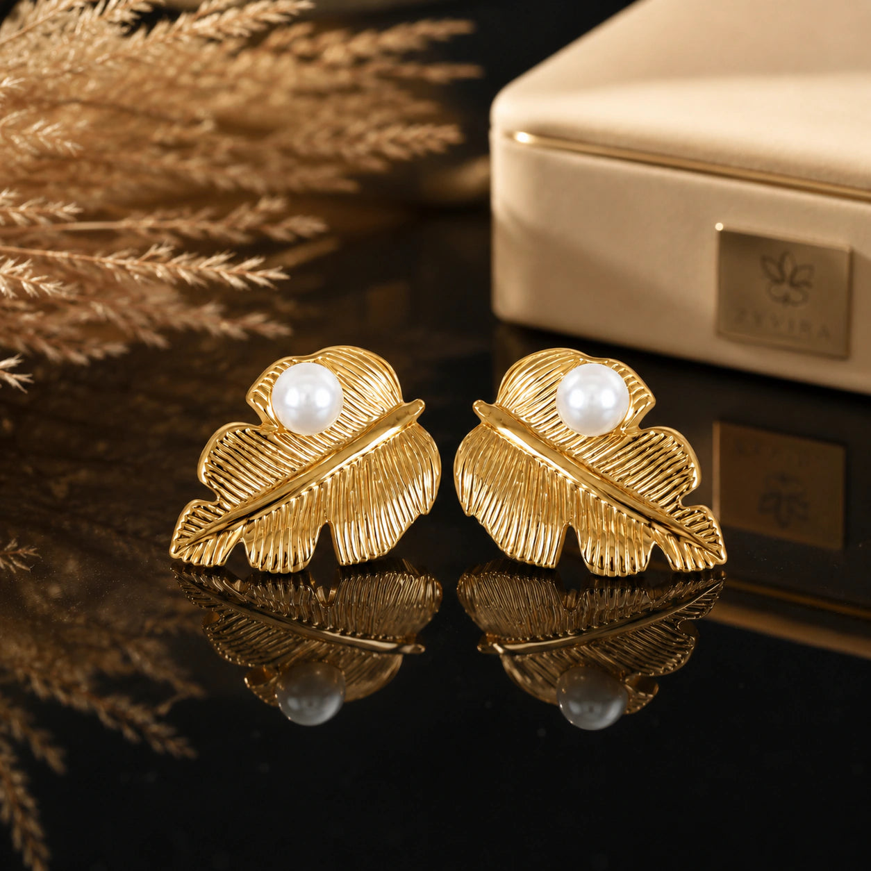 Close-up of ribbed gold leaves and pearl-style centres