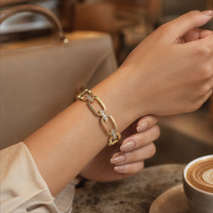 Side view of the gold ribbed oval-link crystal bracelet