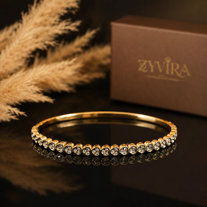 Gold-tone round crystal bezel tennis bangle bracelet