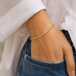 Side view of the gold round crystal tennis bangle