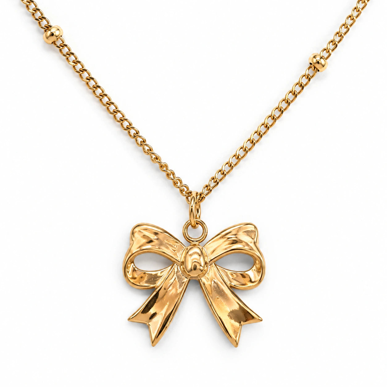 Gold-tone sculpted bow charm pendant necklace