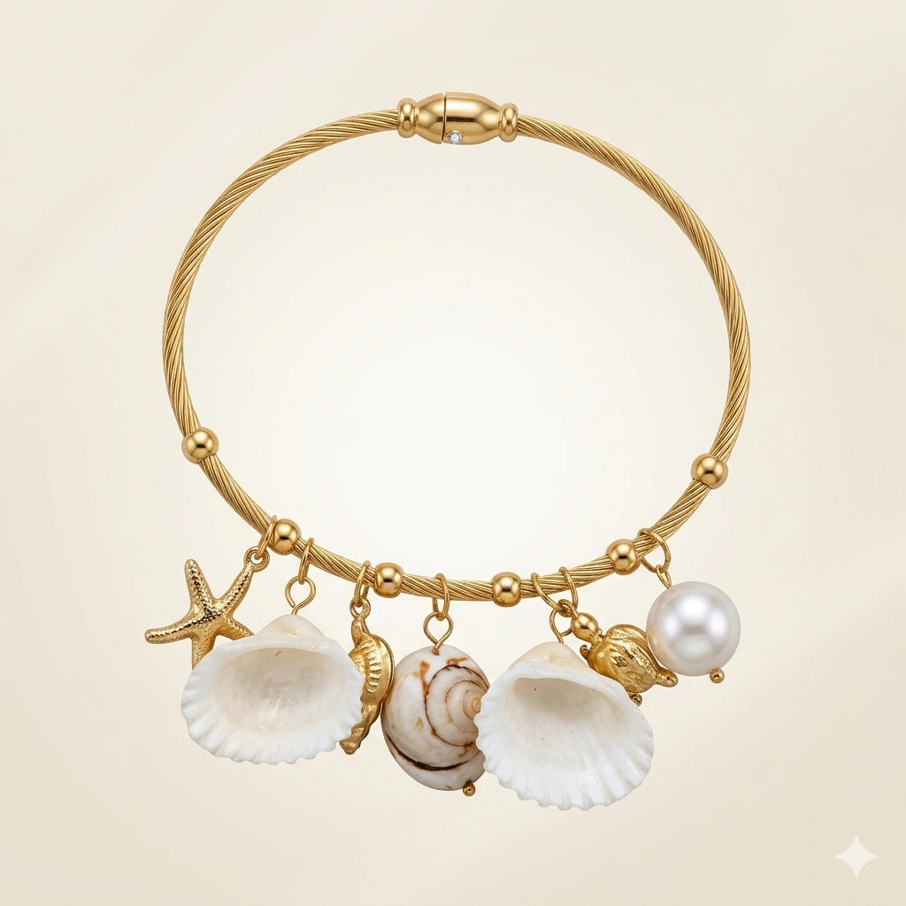 Side view of the gold shell starfish pearl charm bracelet
