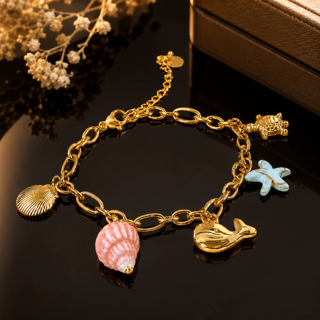 Close-up of shell, turtle and starfish charm detailing