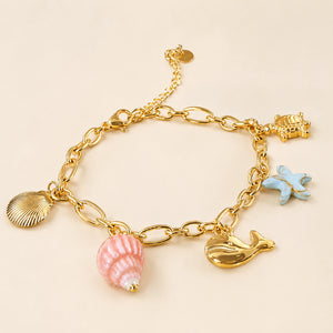 Side view of the gold shell turtle starfish bracelet