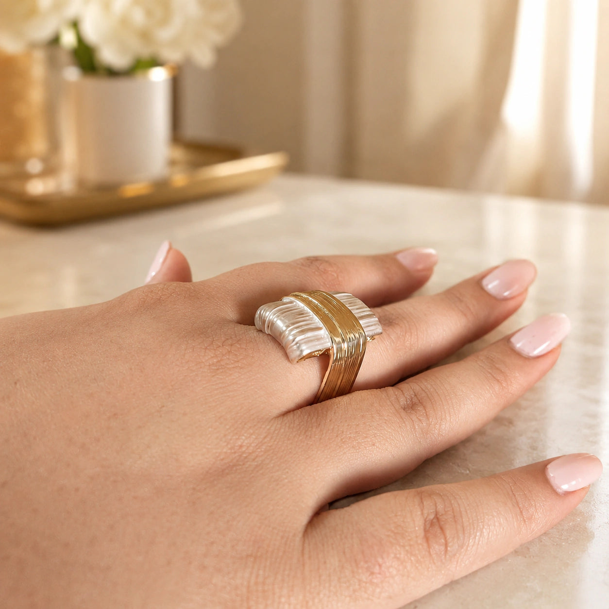 Side view of the gold and silver geometric wrap ring