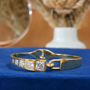 Side view of the gold square crystal-bar hinged kada