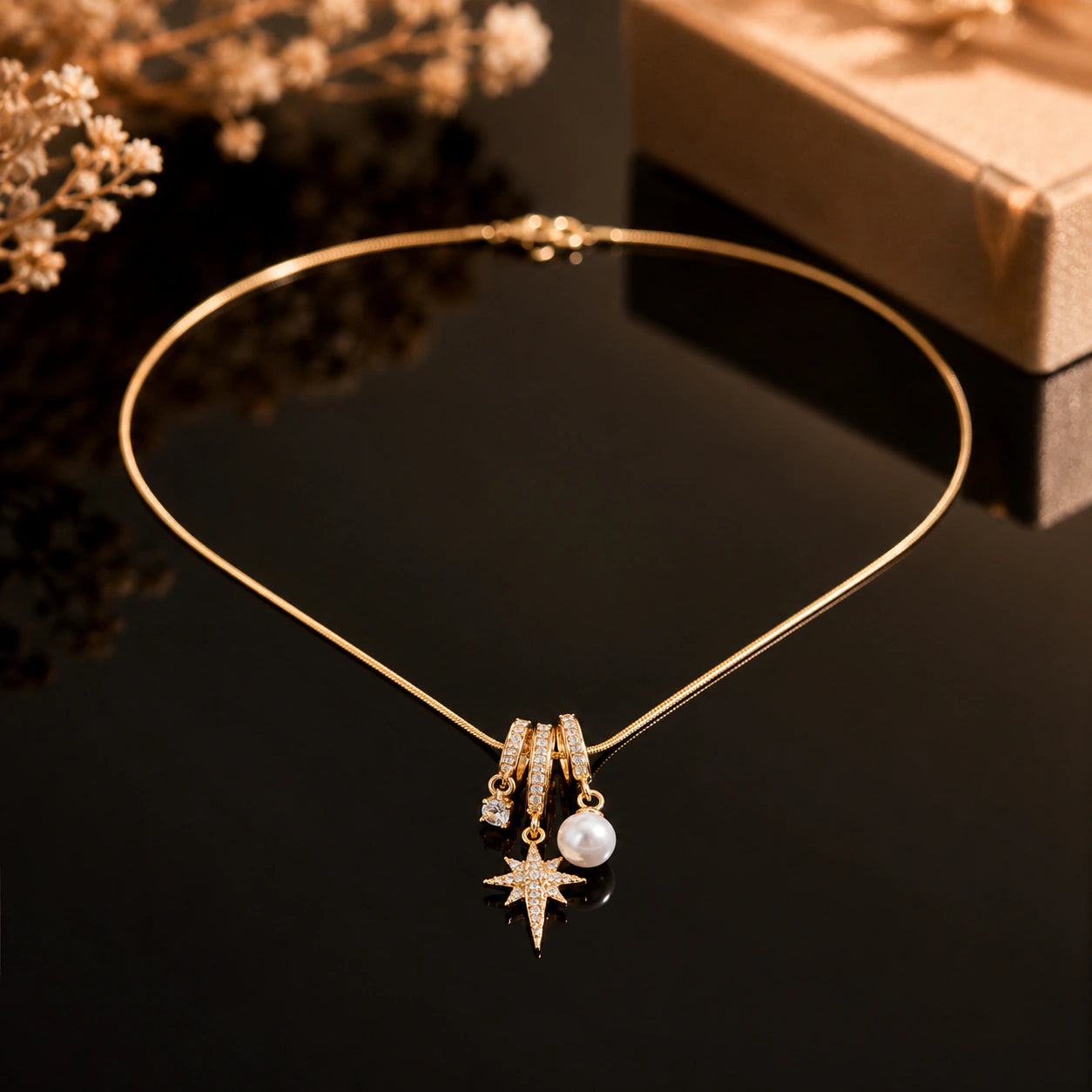Alternate product view of the gold starburst pearl necklace