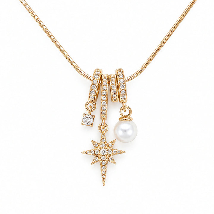 Gold-tone celestial starburst pearl charm necklace