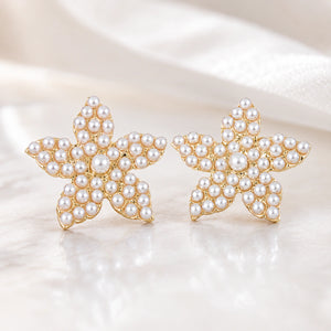 Product details card for gold starfish pearl stud earrings