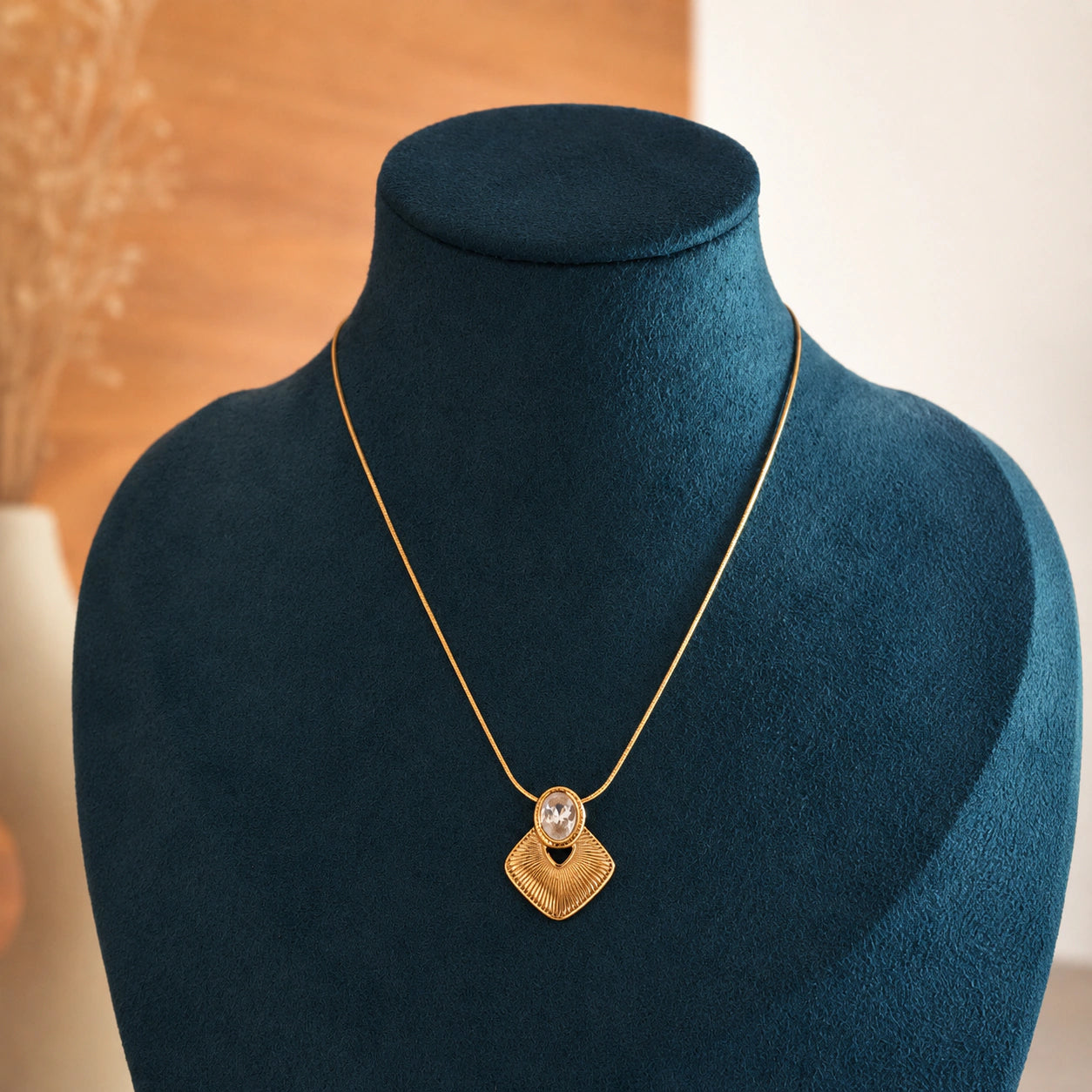 Alternate product view of the gold sunburst oval necklace