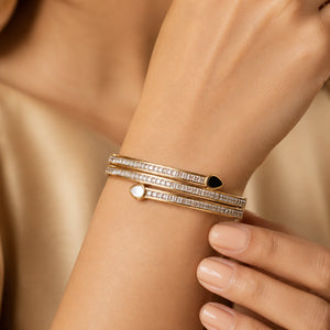 Angled view of the gold teardrop crystal layered kada