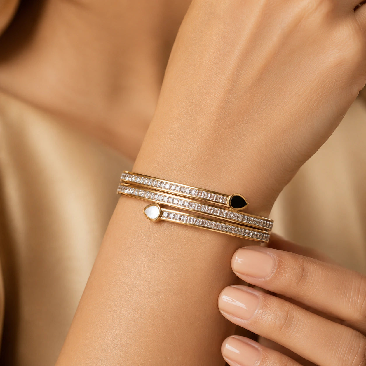 Angled view of the gold teardrop crystal layered kada