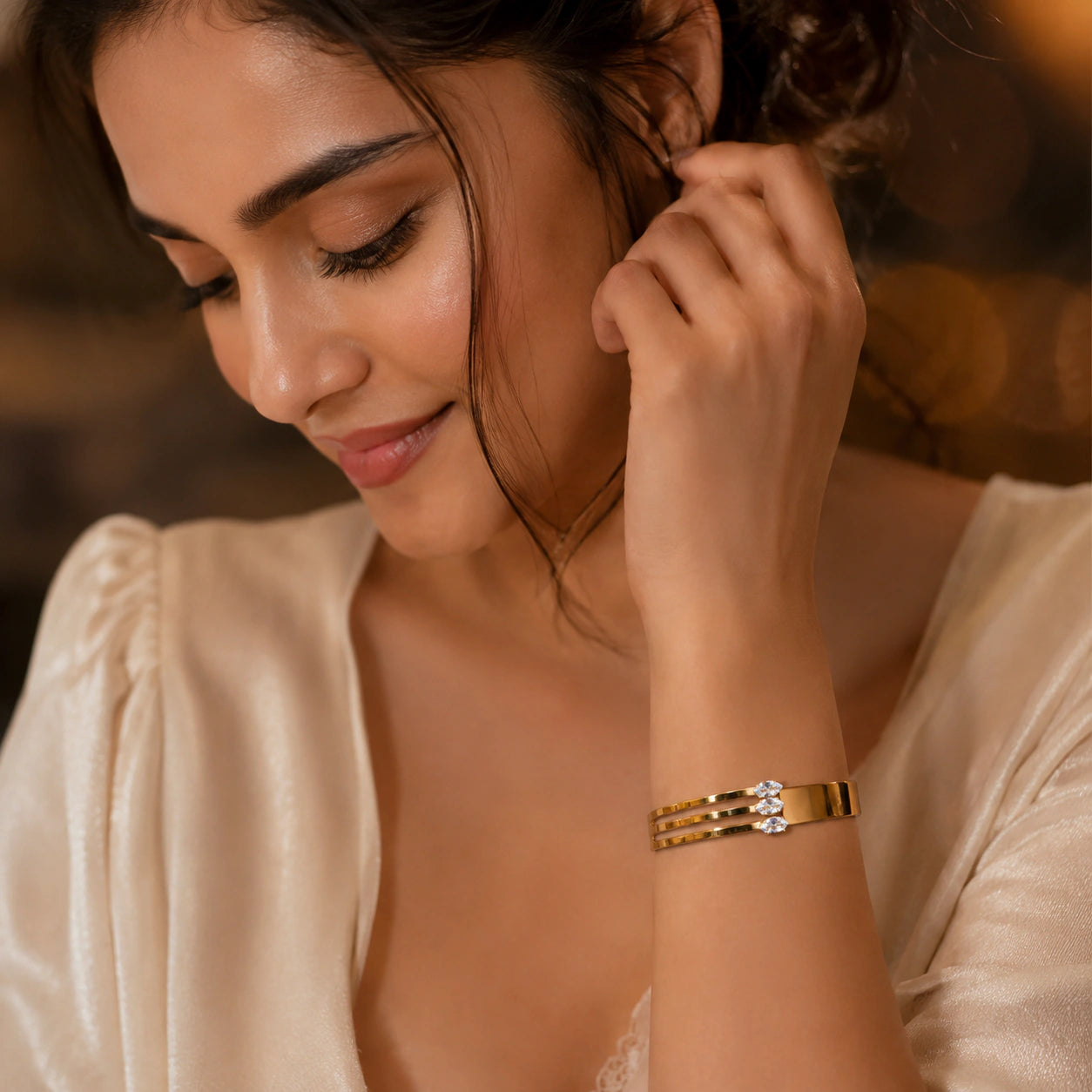 Side view of the gold triple-bar crystal kada