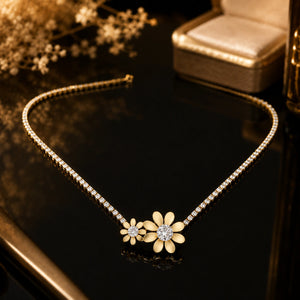 Side view of the gold twin floral crystal necklace