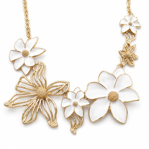 Gold white floral openwork Hasali on a dark jewellery studio display