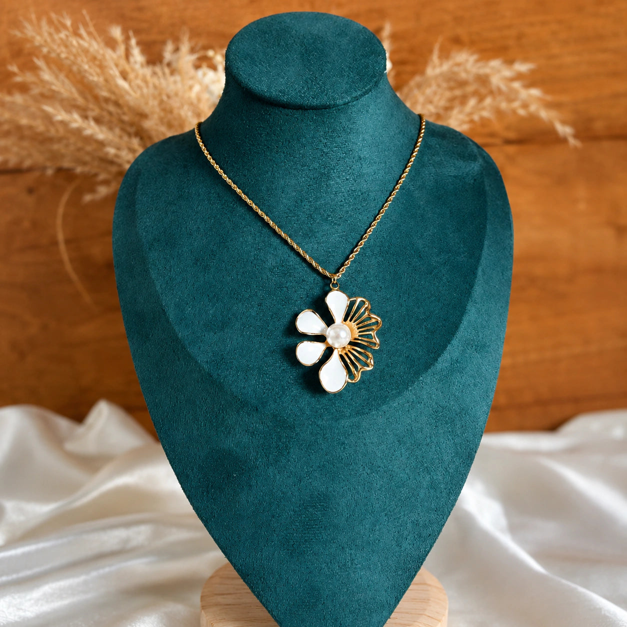Angled view of the gold white floral pearl necklace