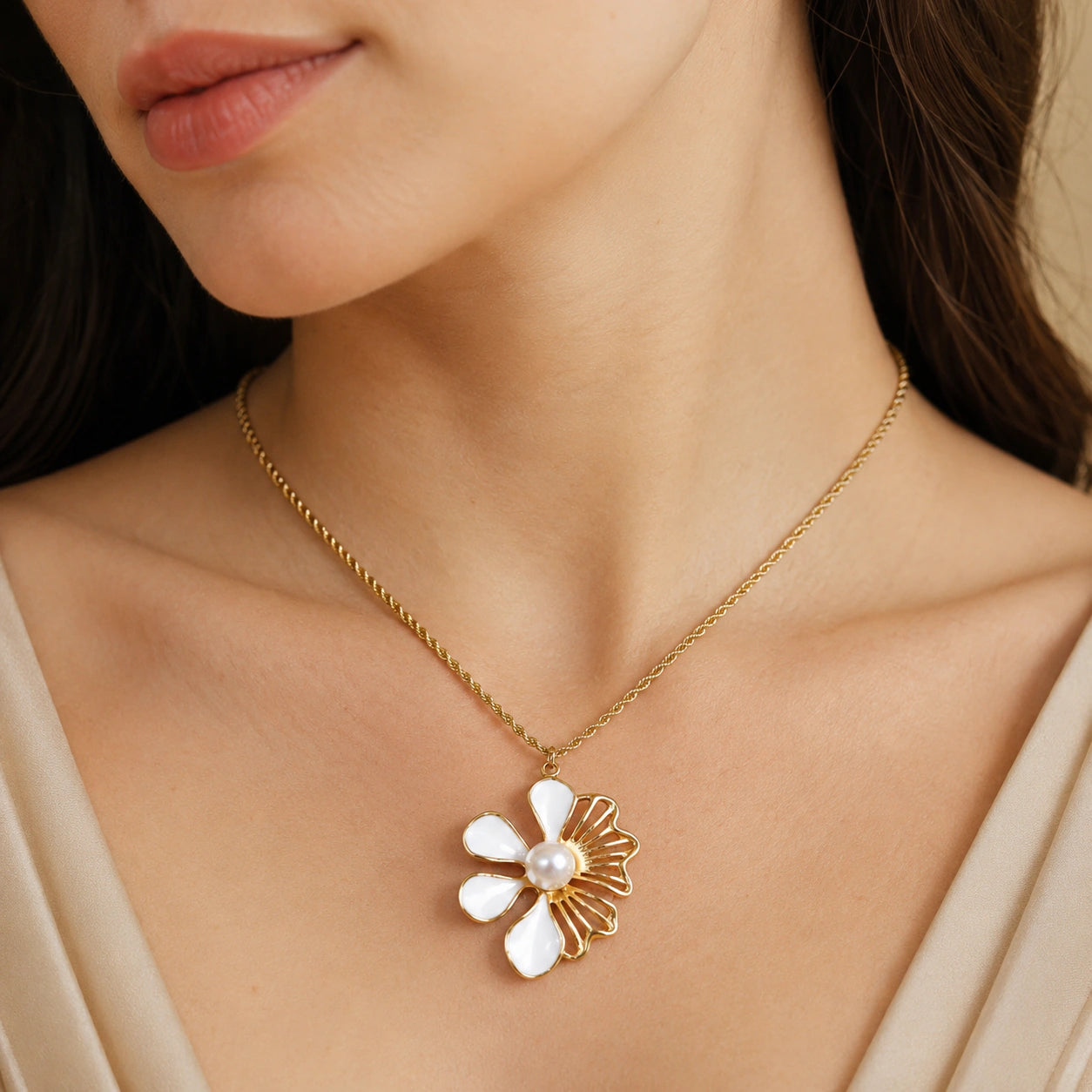Gold white floral pearl necklace on a dark jewellery studio display