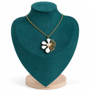 Gold white floral necklace styled in an elegant jewellery flat lay