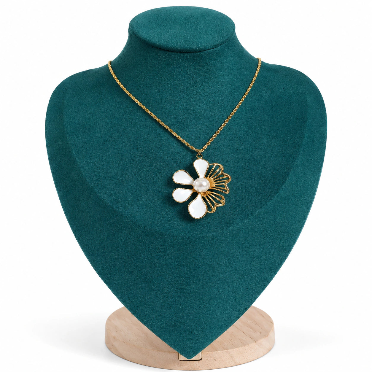 Gold white floral necklace styled in an elegant jewellery flat lay