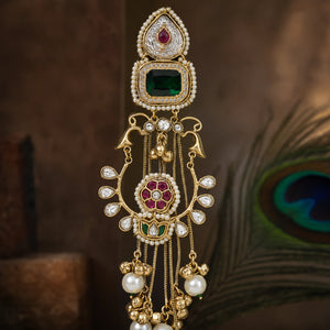 Alternate product view of long gold-tone green-stone Kundan-style statement earrings