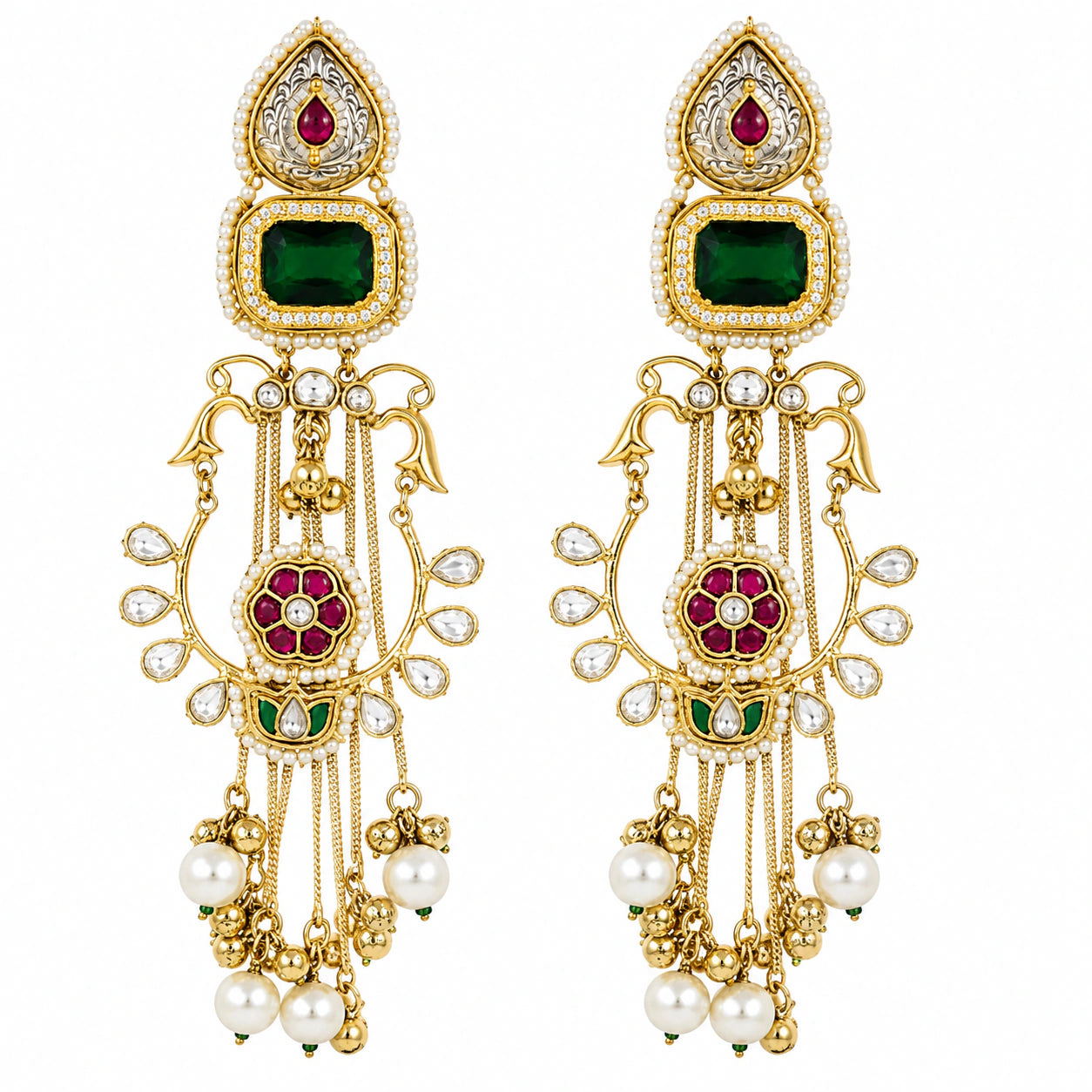 Angled view of long green-stone Kundan-style earrings with layered hanging details