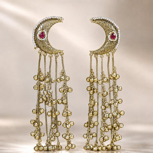 Angled view of gold-tone Kundan-style chandbali earrings with hanging details