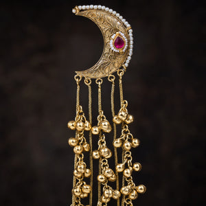 Close-up of Kundan-style stones and detailed gold-tone chandbali craftsmanship