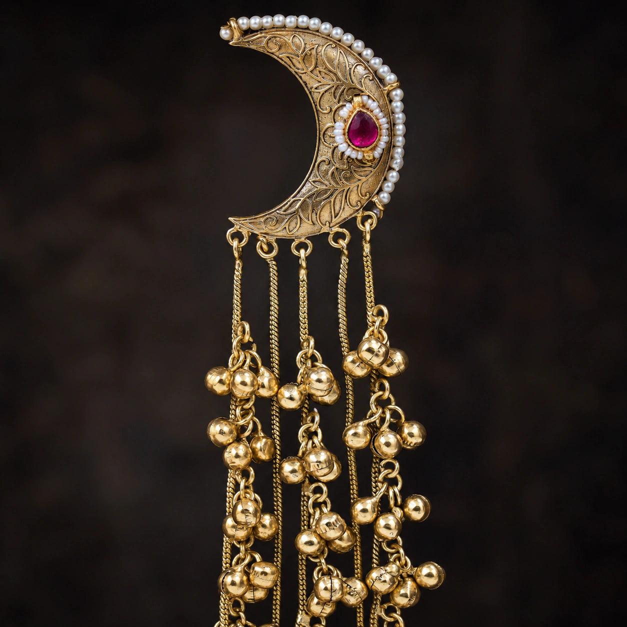 Close-up of Kundan-style stones and detailed gold-tone chandbali craftsmanship